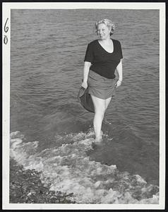 Wading Weather-Miss Helene Canavan of Winthrop took advantage of yesterday's balmy spring weather to go wading at Short Beach, Winthrop. The day was a record-breaker for warmth.