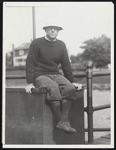 Forgetting cares of state, Charles Francis Adams, secretary of the navy, appears in an informal pose at Marblehead, Mass., after participating in yacht races there.