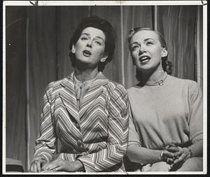 Rosalind Russell as Ruth and Edith Adams as her sister Eileen sing of their native Ohio in "Wonderful Town," the gay new musical comedy - Shubert Theatre - 2 weeks Jan. 26 thru Feb. 7