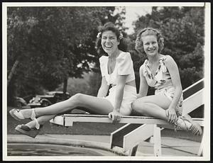 Keeps Cool While Hubby Boils. Mrs. Paul Runyan and a friend, Miss Gloria Donaldson, kept cool at the pool on the Shawnee,Pa., country club while Runyan blistered par in the qualifying round of the PGA tournament. The little White Plains, N.Y. star came in with two under par for a 70 that tied him with Ralph Guldahl, Open Champ.