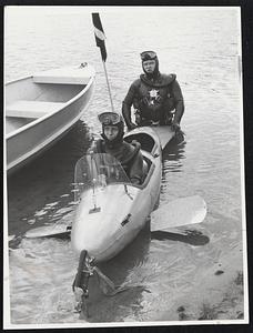 Davy Jones Divers-Arthurs Geddes in bow and Don Conroy show off new "submarine" in which scuba divers can stay for an hour, twice as long as a swimming diver who is using up oxygen in tanks.