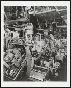 From General Motors Annual Report: Battery of engine dynamic balancing machines specially developed by GM Research Laboratories Division for Chevrolet-Flint V-8 engine plant. Engines balanced by these machines are so vibration-free that a coin will stand erect on them at 2,500 RPM