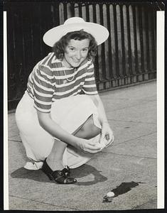 Frying An Egg on Beacon Street was the method used by Doris Crough of Worcester to show how hot it was in Boston yesterday.