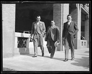 Jack Sharkey and Ernie Schaaf walking with an unidentified man