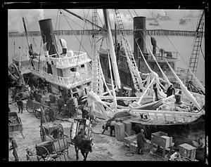 Ice covered trawler at pier