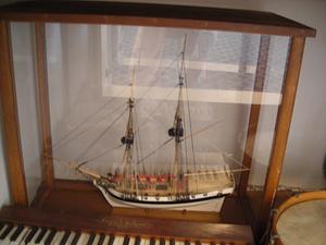 Model sailing ship inside wooden case