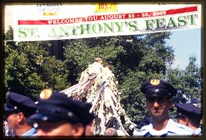 Boston 2002: A statue of St. Anthony is carried under a banner proclaiming St. Anthony's Feast in city's N. End area