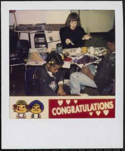 Three people making art