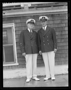 Two men in uniform at yacht club