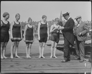 Winners being presented with medals, swim competition, Charles River