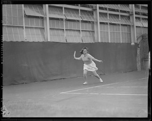 Woman player in action, possibly Longwood