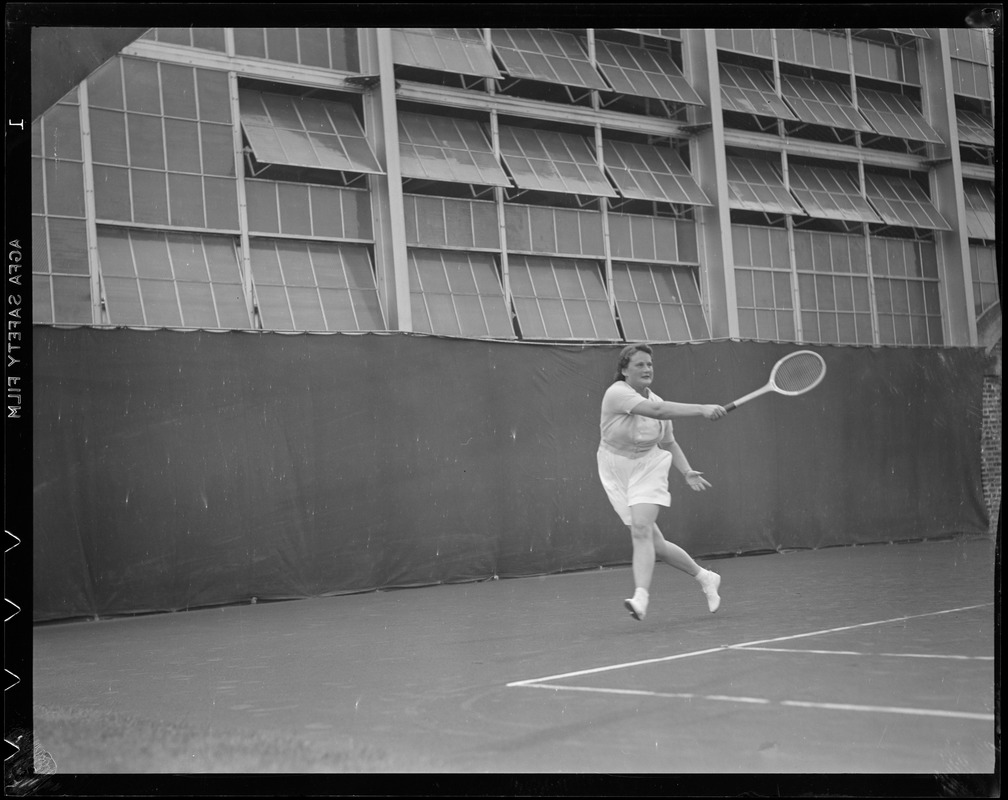 Woman player in action, possibly Longwood