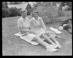 Two women pose on lawn at Longwood during doubles championships