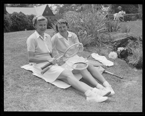 Two women pose on lawn at Longwood during doubles championships