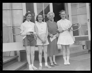 Older lady with three young players at Longwood doubles championships