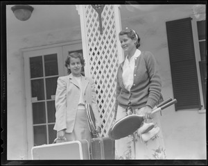 Two women dressed for travel