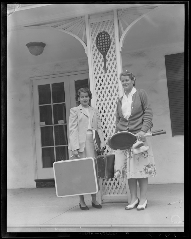 Two women dressed for travel