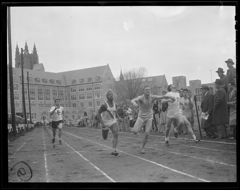 Jumbo Reggie Alleyne, left, beating the Rams Joe Pizzo at tape, while Tufts' Alan Schurer holds off Rams' Art Tingley at Tuft's - Rhode Island - Boston College triangular track meet at the Heights