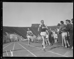 Harvard vs. Holy Cross relay race at Harvard Stadium