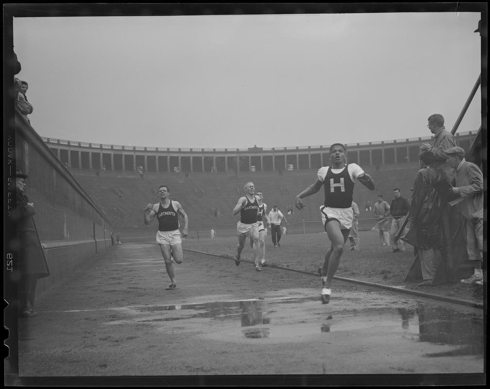 Harvard runner leads field at Harvard Stadium at Harvard-Dartmouth meet