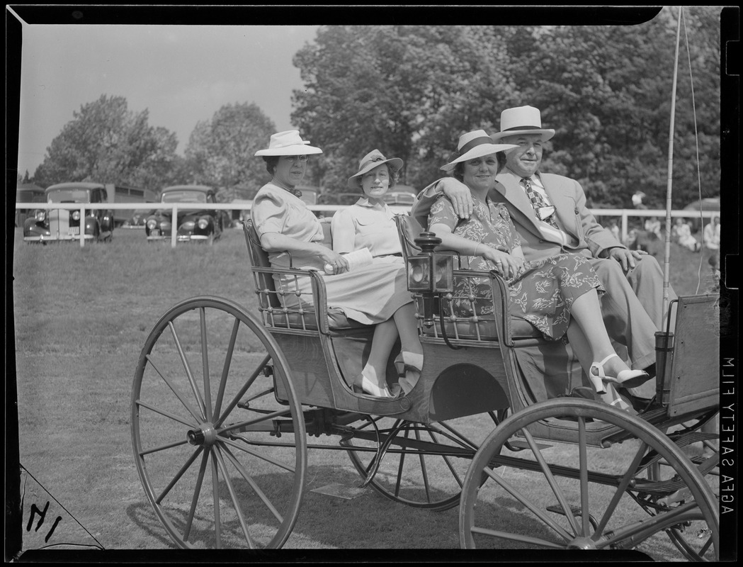 Four people in a carriage