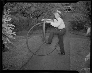 Man with old fashioned bike