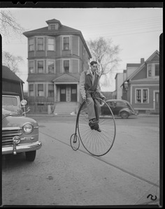 Man on old-time bike