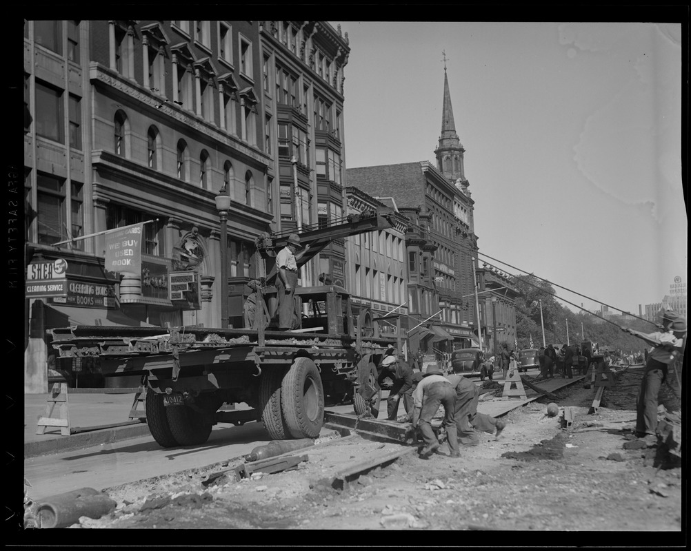 Crew removing last of street car tracks from Boylston St.