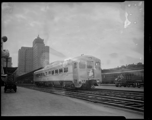 Commuter train at North Station showing hotel manager