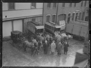 Old Boston conveyances pictured at Public Works Dept. yard on Albany Street to be shipped to historical societies, include Mayor Hart's sleigh and police transports
