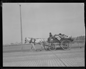 Horse drawn junk collector on Charles River Bridge