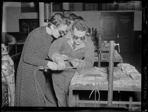 Woman instructed in soldering, WWII