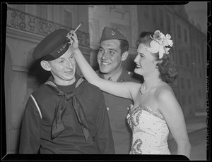Show girl signs sailor's hat, WWII
