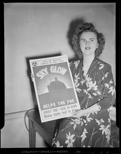Woman holding blackout poster