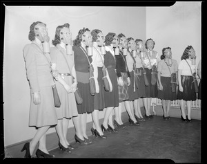 Women wearing the latest gas masks, WWII era
