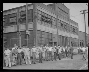 Workers outside S.A. Woods Co. in South Boston after the munitions plant was seized by the Army