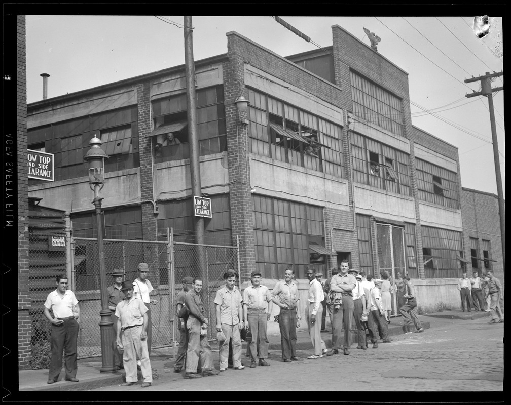 Workers outside S.A. Woods Co. in South Boston after the munitions plant was seized by the Army