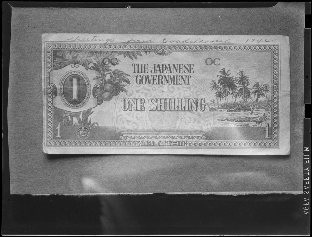 Woman with Japanese one shilling note with "Greetings from Guadalcanal" written on it