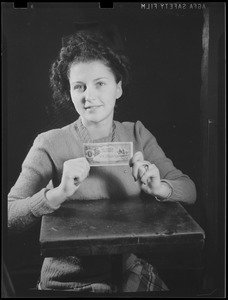Woman with Japanese one shilling note with "Greetings from Guadalcanal" written on it
