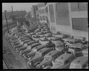 WWII: Taxis with no tires in lot, tires for scrap