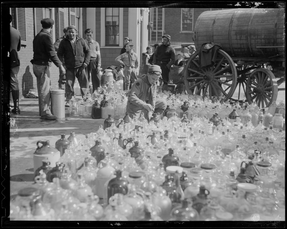 Jugs being filled with water from water cart, New England floods