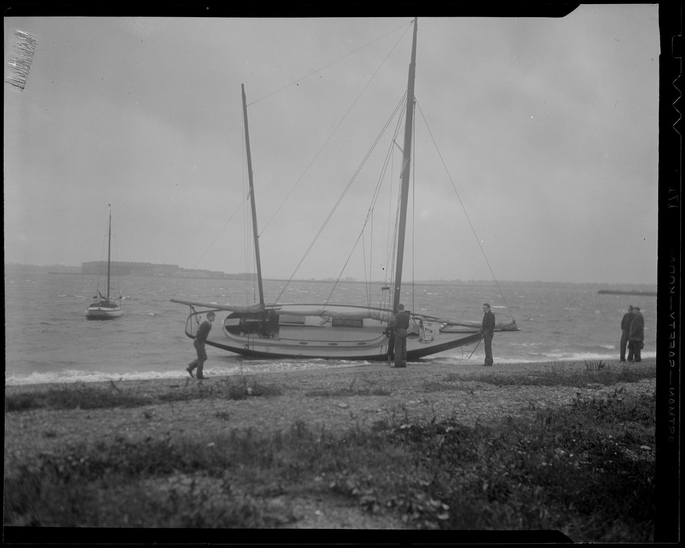 Sailboat blown ashore by storm