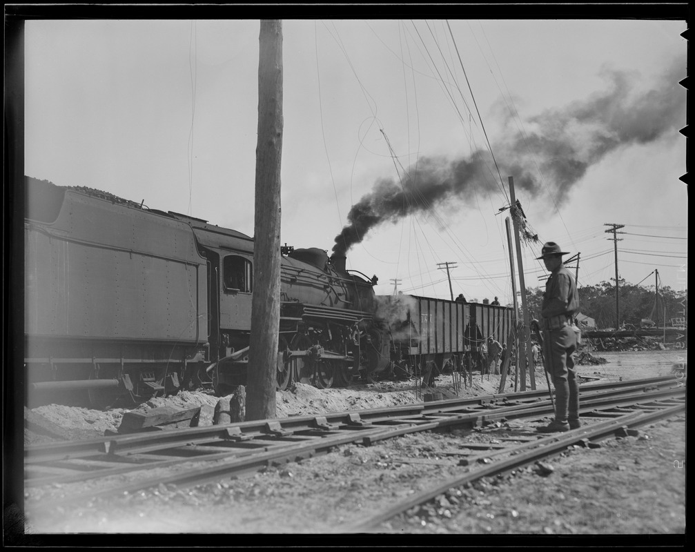 Railroad cars haul in fill for repairs, Hurricane of 38