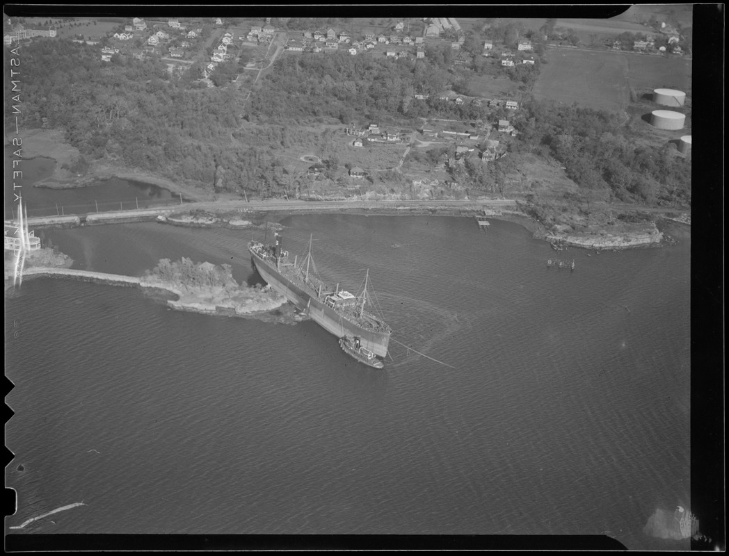 Aerial photo of freighter aground on small island, Hurricane of 38