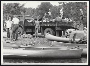 River Rescue Gang. A working party of the Ozark Wilderness Waterways Club of Kansas City has a satisfactory reward for a day on the river: a haul of garbage, collected from the Current River on their annual Labor Day cleanup. The canoeists are city folk who revere the wilderness-and are prepared to act to keep it unspoiled.