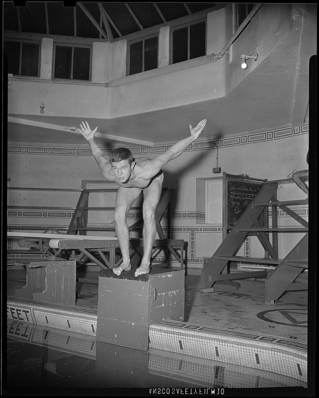 SC swimmer about to dive off the starting block