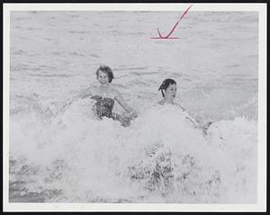 Hurricane Connie's Only Effect on New England to date has been rough water like this off Winthrop Beach. Enjoying it are Hazel Shapiro and Moira Grant, both of Winthrop.