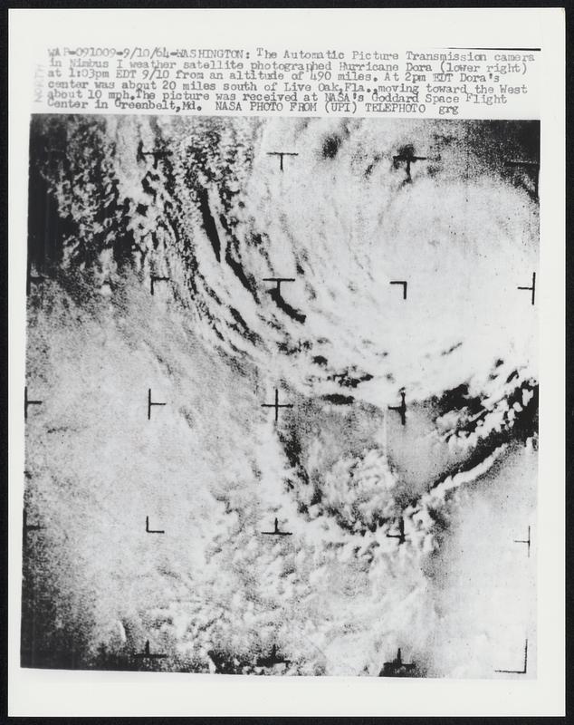 The Automatic Picture Transmission camera in Nimbus 1 weather satellite photographed Hurricane Dora (lower right) at 1:03pm EDT 9/10 from an altitude of 490 miles. At 2pm EDT Dora's center was about 20 miles south of Live Oak, Fla., moving toward the West about 10 mph. The picture was received at NASA's Goddard Space Flight Center in Greenbelt, Md.