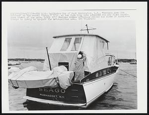 Hollister Cox of Port Washington, L.I., "battens down the hatches" on the vessel "Seago," 9/22, as New York City area prepares for its first hurricane threat of the year. Early 9/23 weather bureau officials stated the force of hurricane Gladys is likely to by-pass the metropolitan area.
