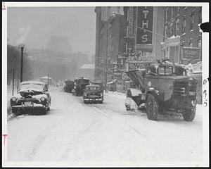 Tremont Street-Snowplows and sanding tracks clear Tremont street after sneak snow storm which slowed traffic to a crawl throughout the Boston area.